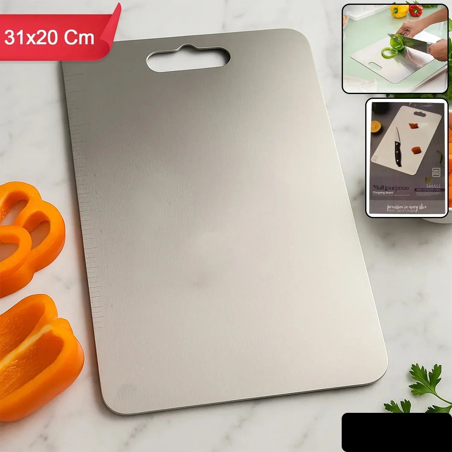 Stainless steel cutting board with dimensions 31x20 Cm on a marble surface with vegetables.